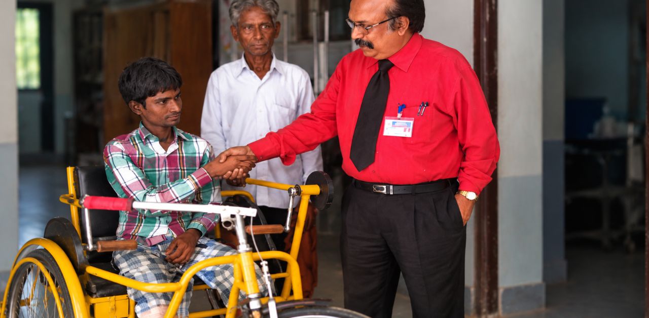 Real-life hero with V. Subramanian after receiving a hand-driven tricycle at an Ahmedabad hospital.